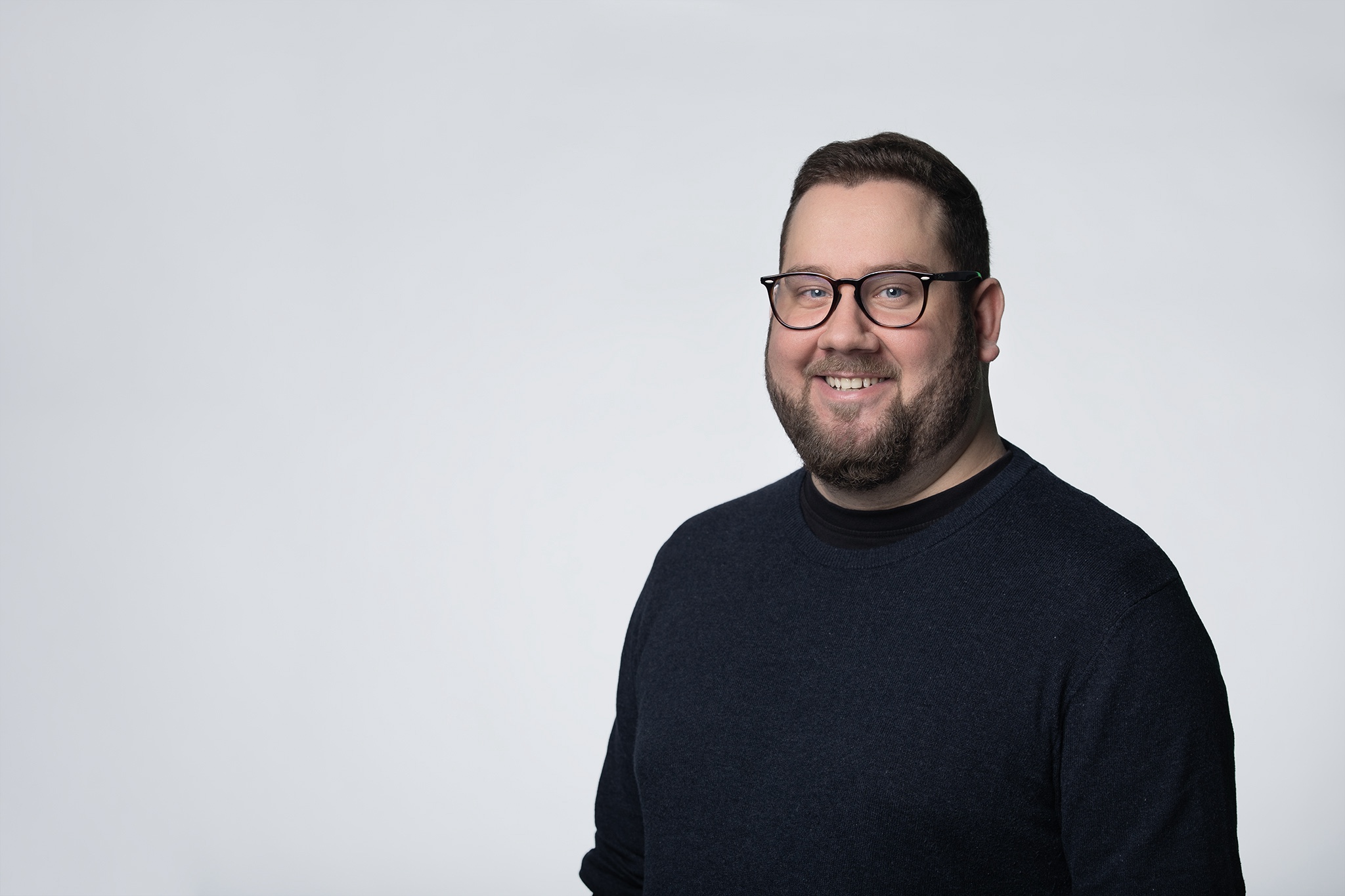 Portrait photo of ParadiplomacyLab team member Michał Gzik on a white background